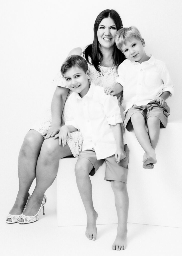 Black and White studio portrait of Mom and two brothers in Katy, TX