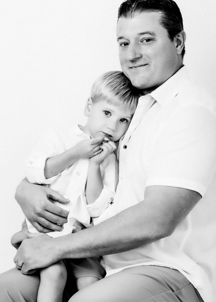 Black and White studio portrait of a Dad and kid in Katy, TX