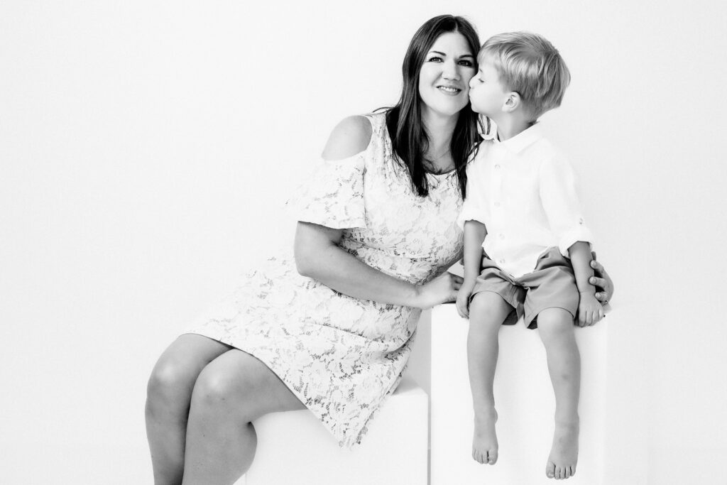 Black and White studio portrait of a Mom with son in Katy, TX