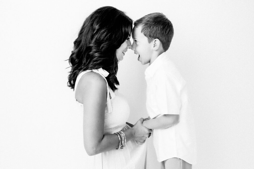 Black and White studio portrait of a Mom with son in Katy, TX