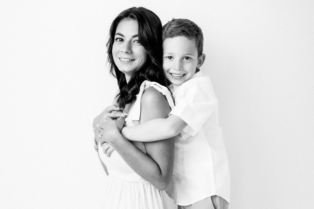 Black and White studio portrait of a Mom with son in Katy, TX